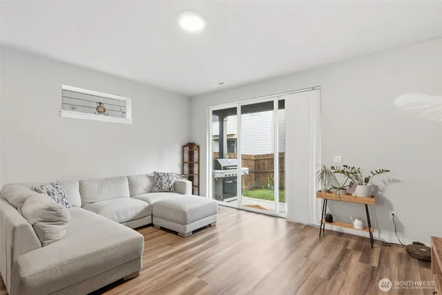 a bedroom with furniture and wooden floor