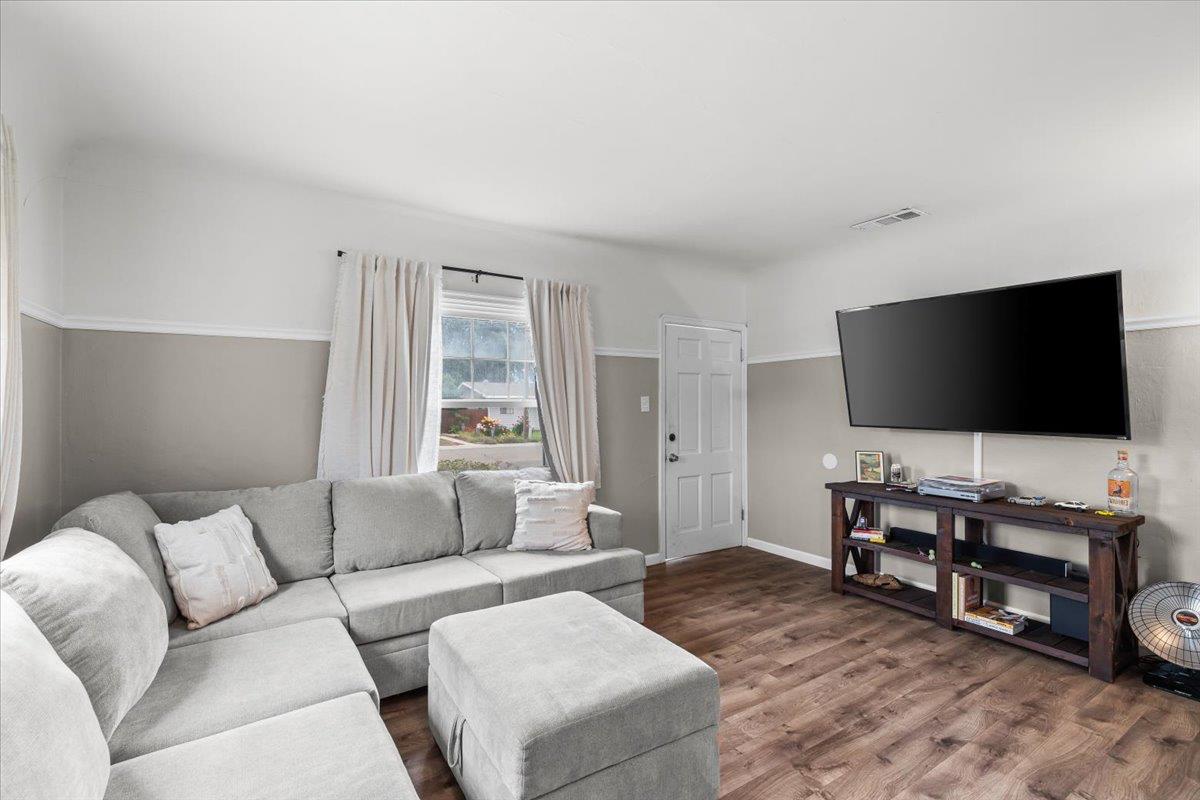 505 South Acacia Avenue Ripon, CA 95366 - Photo 11 of 38 a living room with furniture and a flat screen tv