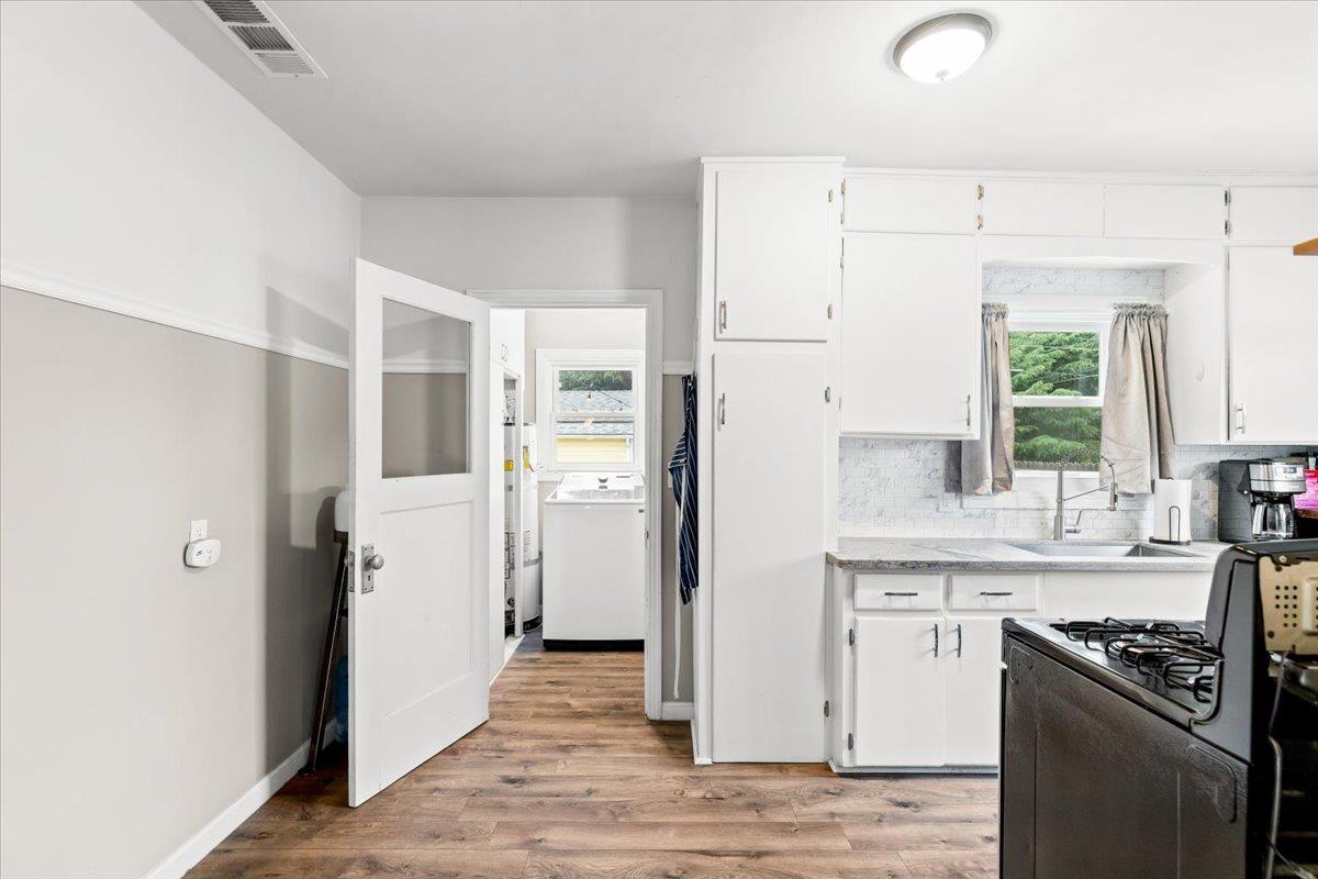 505 South Acacia Avenue Ripon, CA 95366 - Photo 17 of 38 a kitchen with white cabinets and refrigerator