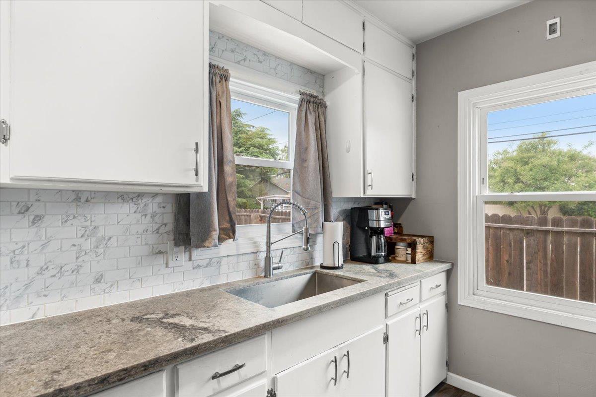 505 South Acacia Avenue Ripon, CA 95366 - Photo 20 of 38 a kitchen with granite countertop a sink and a window
