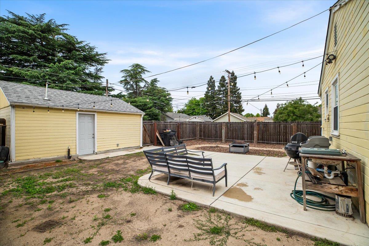 505 South Acacia Avenue Ripon, CA 95366 - Photo 34 of 38 a view of a backyard with chairs and a stove