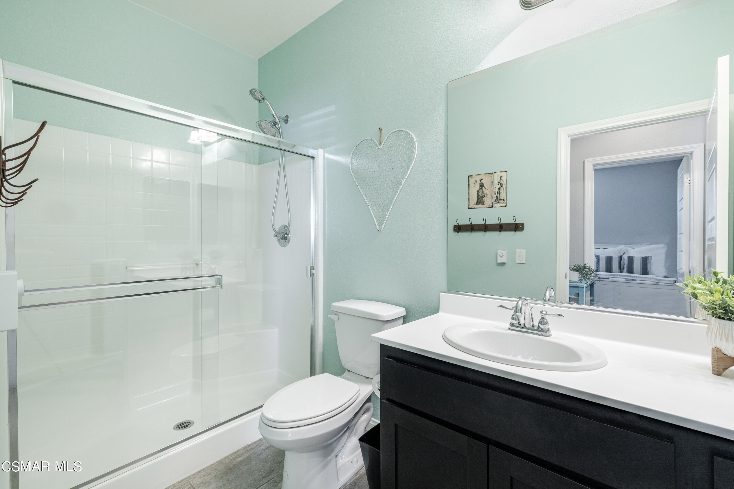 396 Edgewood Drive Fillmore, CA 93015 - Photo 16 of 29 a bathroom with a sink toilet and shower