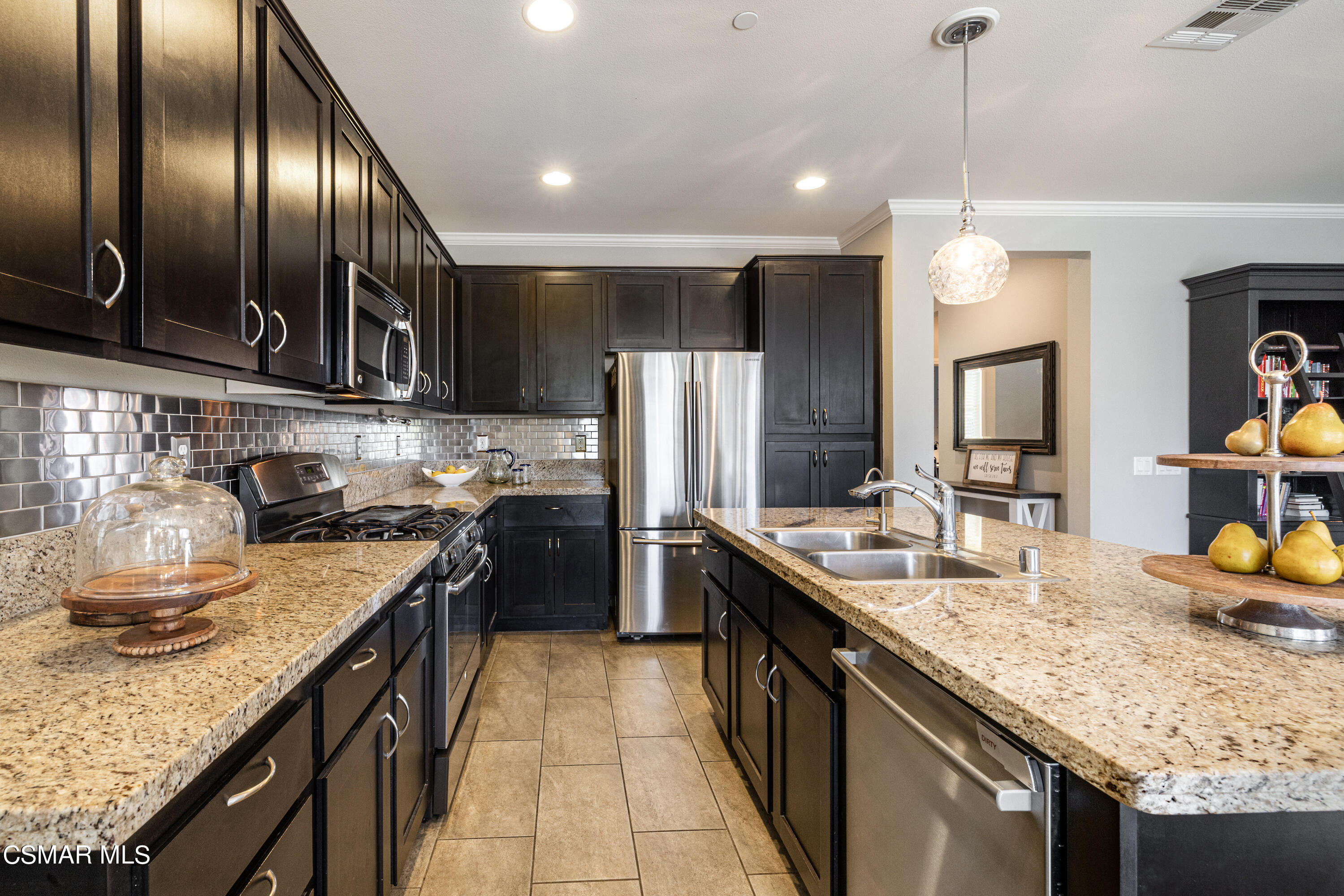 396 Edgewood Drive Fillmore, CA 93015 - Photo 6 of 29 a kitchen with stainless steel appliances granite countertop a sink a stove and a wooden floors