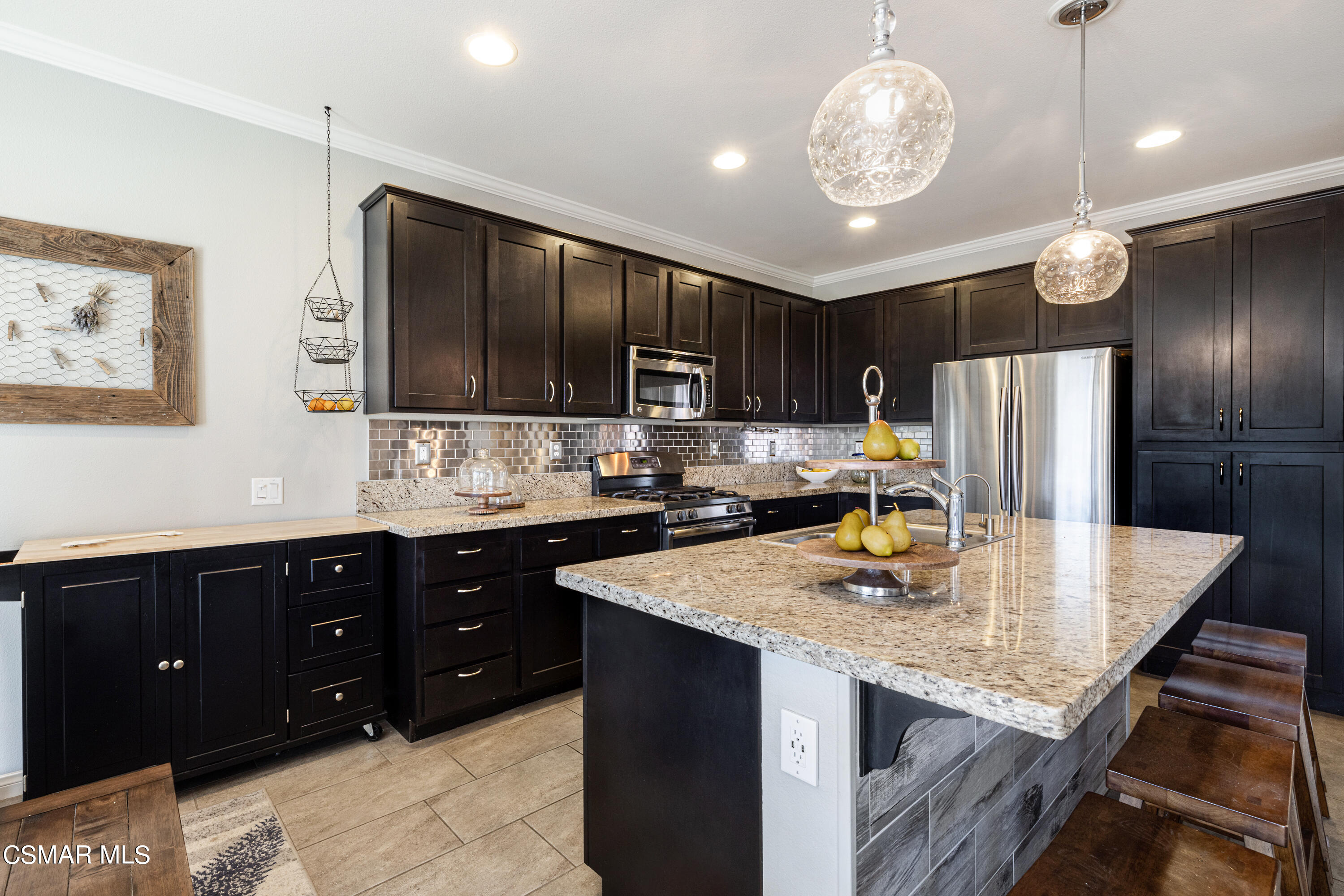 396 Edgewood Drive Fillmore, CA 93015 - Photo 8 of 29 a kitchen with stainless steel appliances granite countertop a sink refrigerator stove and microwave