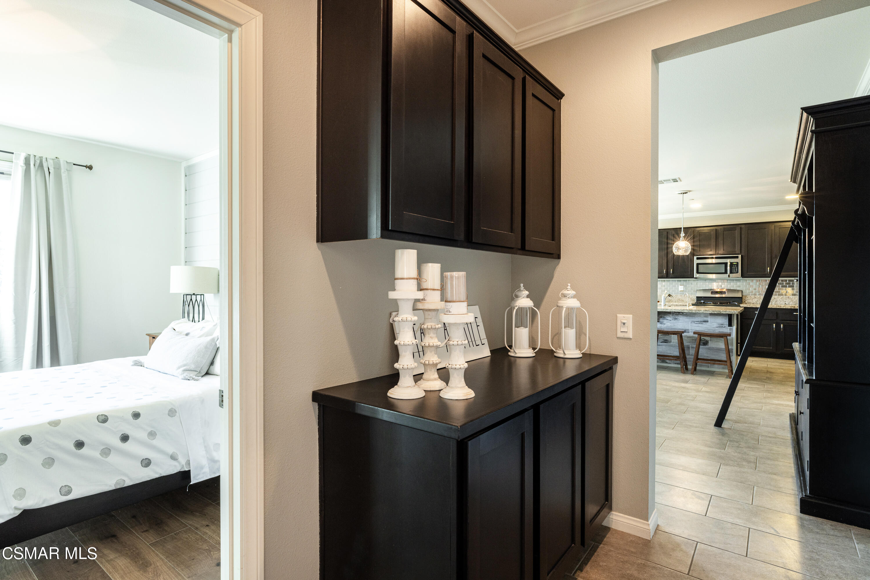 396 Edgewood Drive Fillmore, CA 93015 - Photo 10 of 29 a kitchen with kitchen island granite countertop a sink stove and cabinets