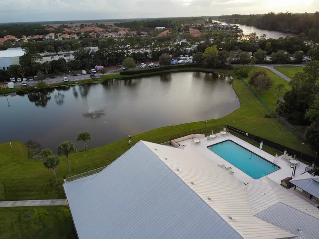 an aerial view of a house with a lake view