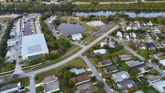 an aerial view of a house with outdoor space lake view
