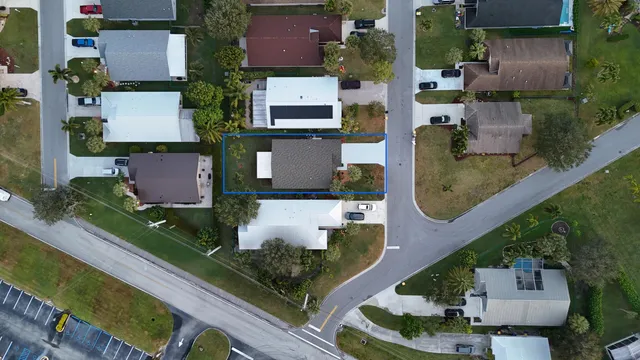 an aerial view of residential houses with outdoor space