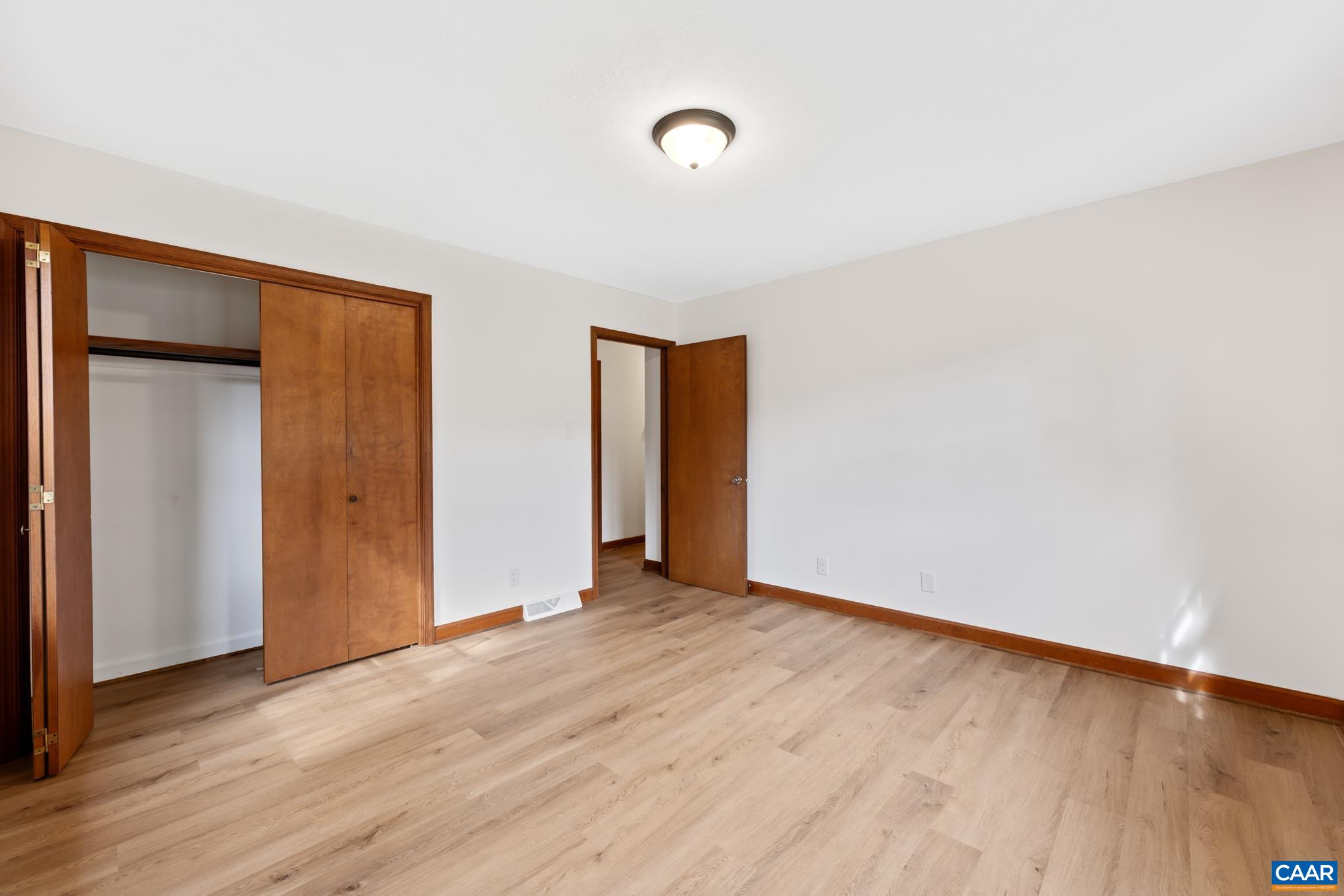 55 Watson Road Ruckersville, VA 22968 - Photo 23 of 37 a view of an empty room with wooden floor and a window