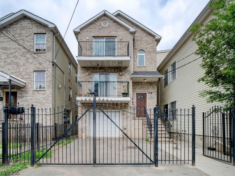 a front view of house along with deck and outdoor space