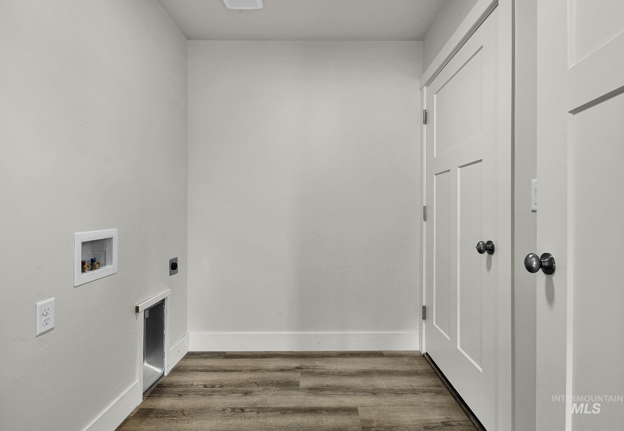 328 Packer Lane Homedale, ID 83628 - Photo 21 of 25 Laundry area featuring wood finished floors, hookup for a washing machine, and electric dryer hookup