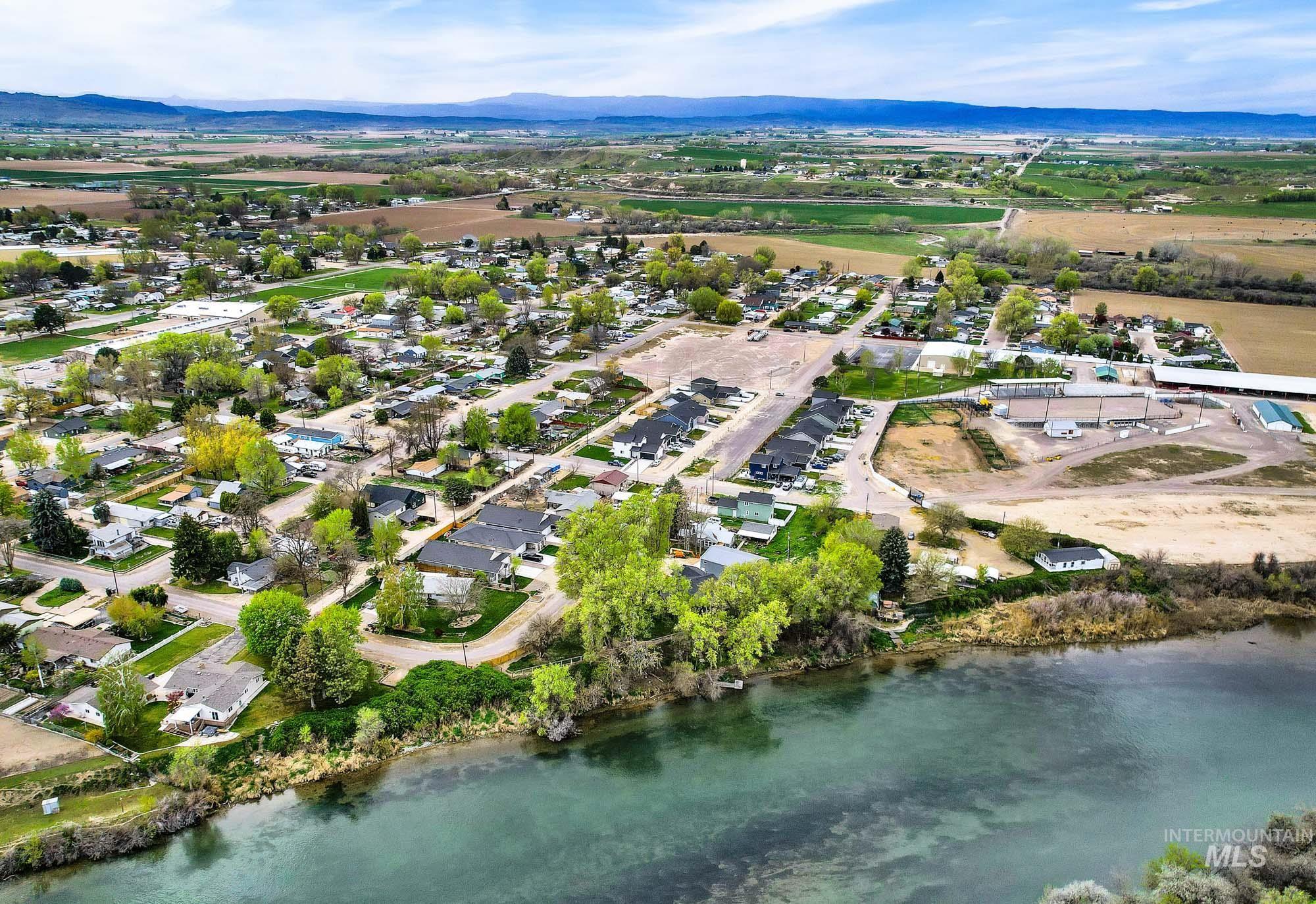328 Packer Lane Homedale, ID 83628 - Photo 25 of 25 Aerial perspective of suburban area with a water and mountain view