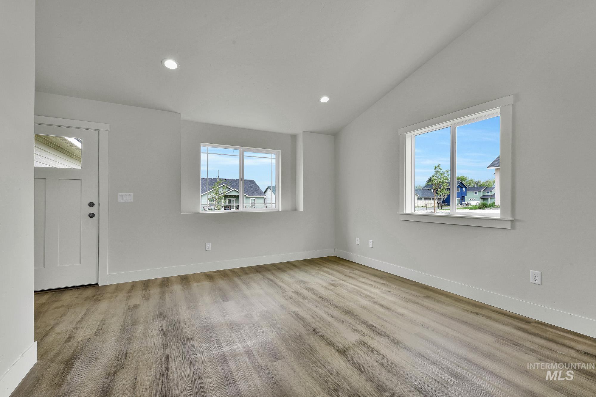 328 Packer Lane Homedale, ID 83628 - Photo 3 of 25 Foyer featuring lofted ceiling, recessed lighting, and light wood-style floors