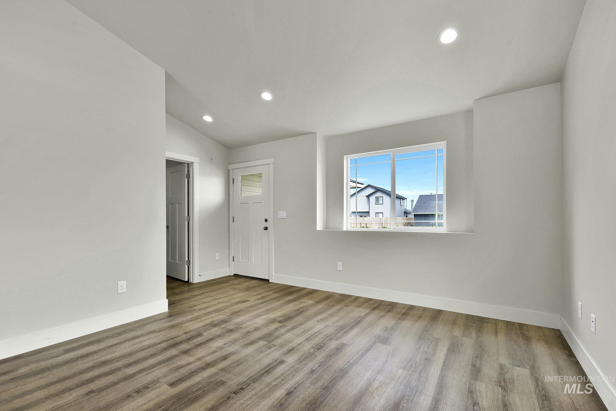 328 Packer Lane Homedale, ID 83628 - Photo 4 of 25 Foyer entrance with recessed lighting, light wood finished floors, and lofted ceiling