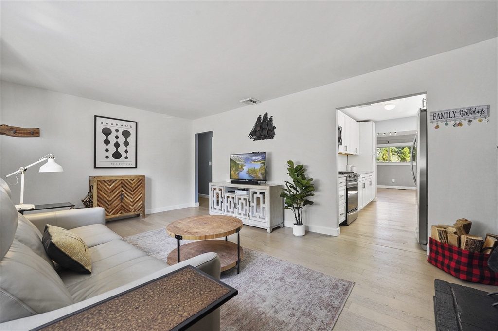101 Prospect Street Acton, MA 01720 - Photo 3 of 21 a living room with furniture and wooden floor