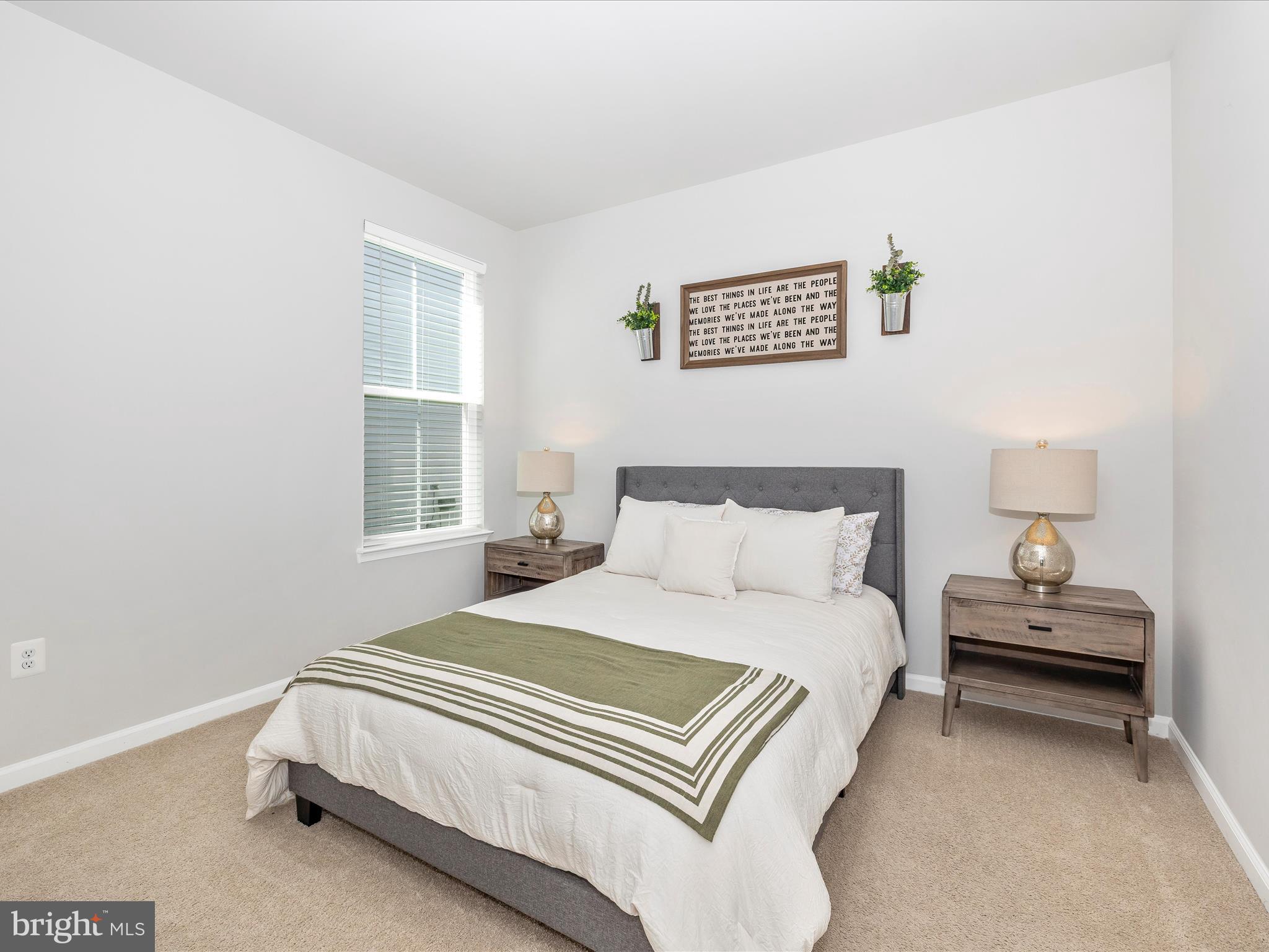 5816 Hawk Ridge Road Frederick, MD 21704 - Photo 20 of 97 a bedroom with a bed and a lamp with window