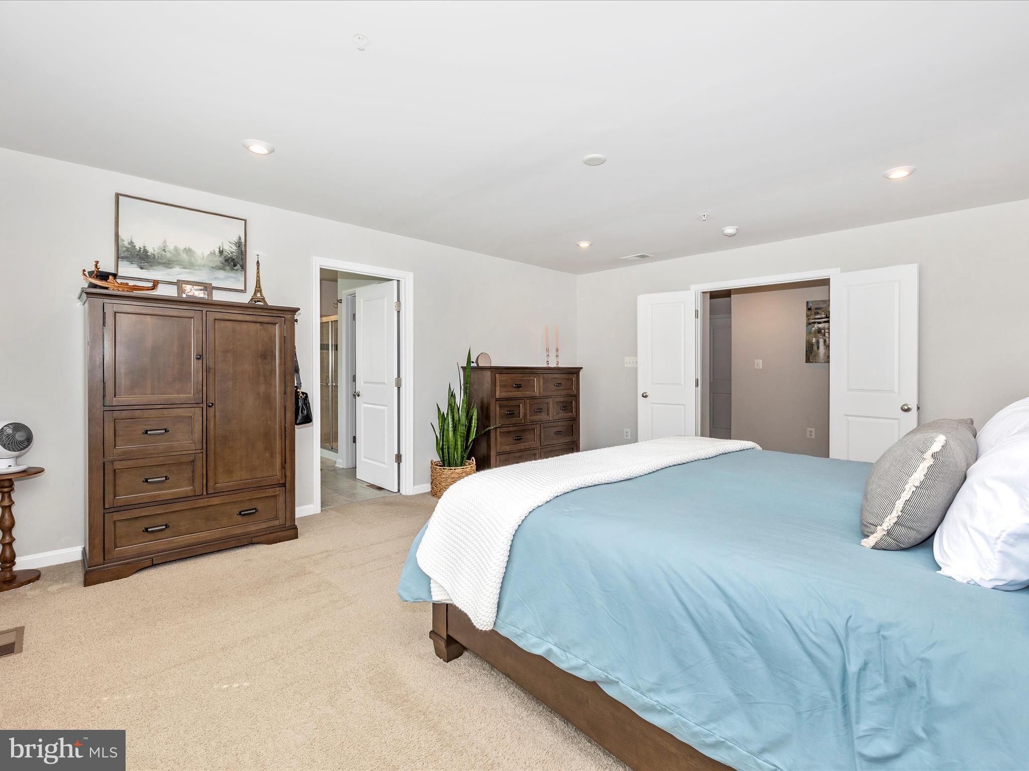 5816 Hawk Ridge Road Frederick, MD 21704 - Photo 25 of 97 a spacious bedroom with a bed and dresser