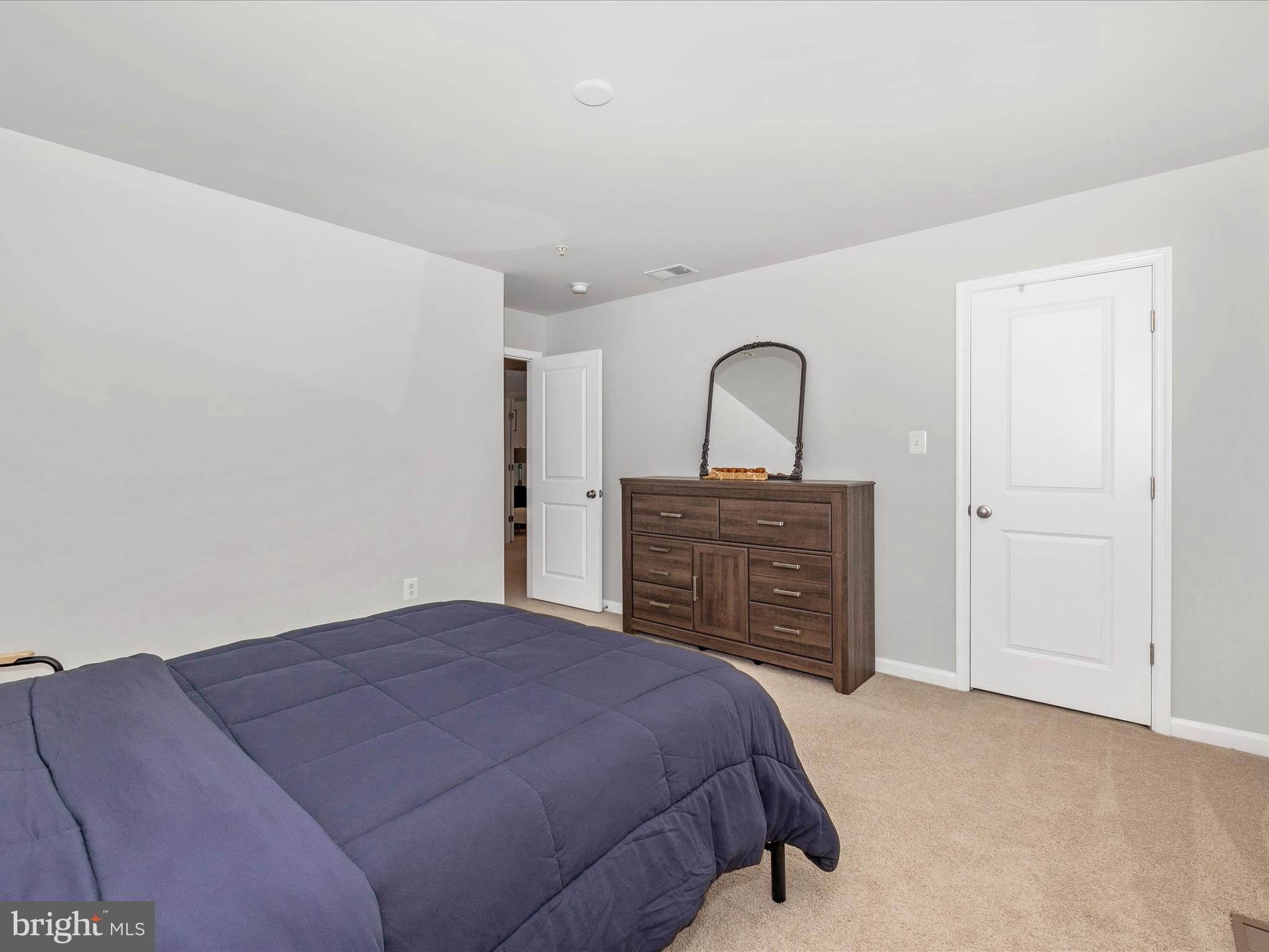 5816 Hawk Ridge Road Frederick, MD 21704 - Photo 36 of 97 a bedroom with a bed and a dresser