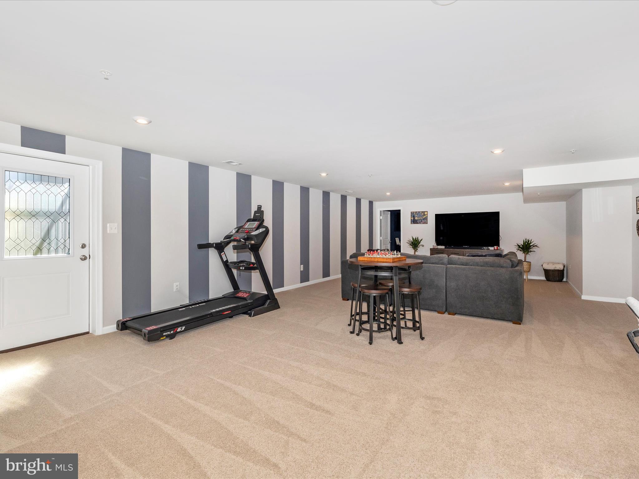 5816 Hawk Ridge Road Frederick, MD 21704 - Photo 39 of 97 a view of a livingroom with furniture and a flat screen tv