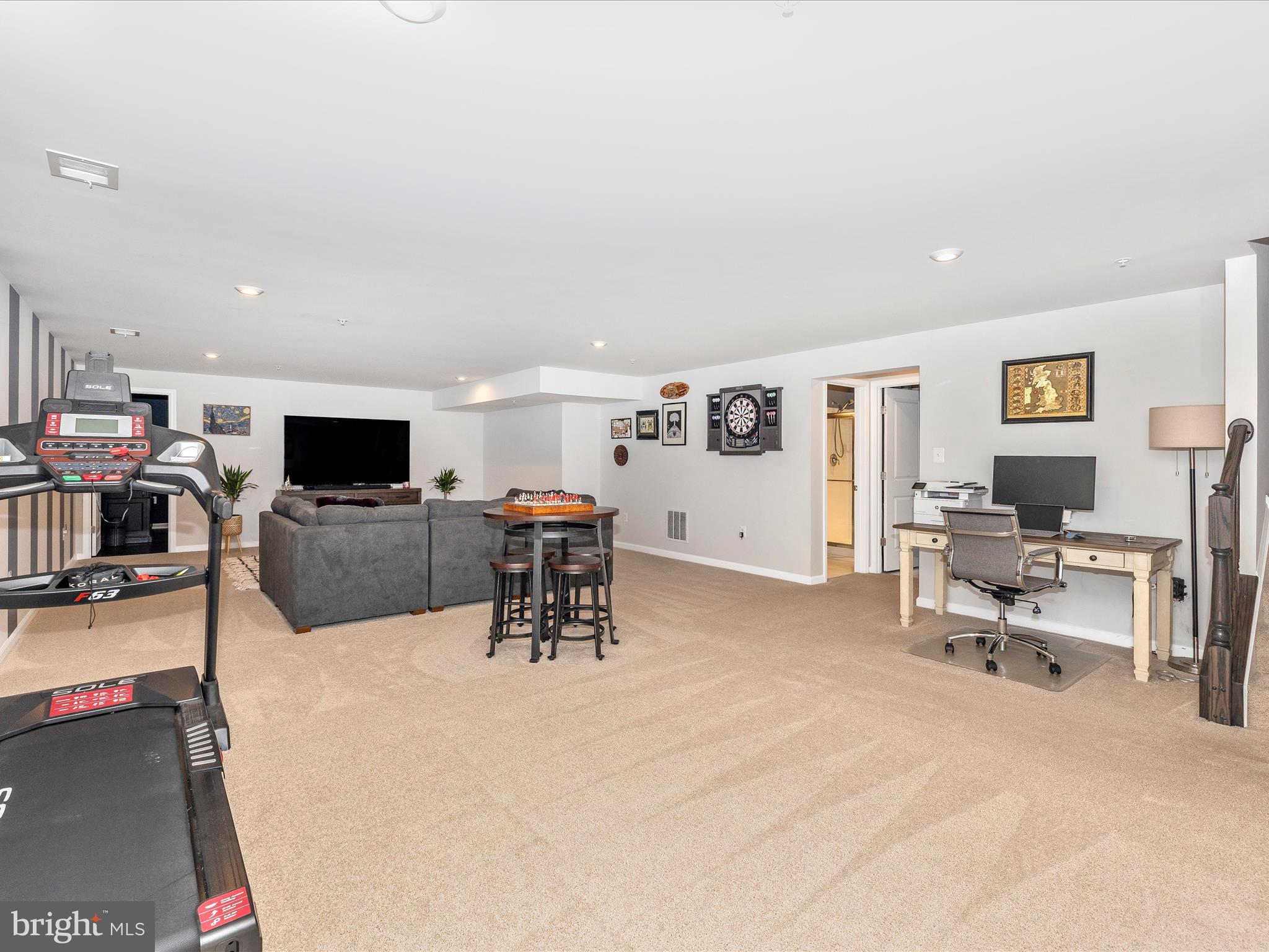 5816 Hawk Ridge Road Frederick, MD 21704 - Photo 40 of 97 a view of a livingroom with furniture and a flat screen tv