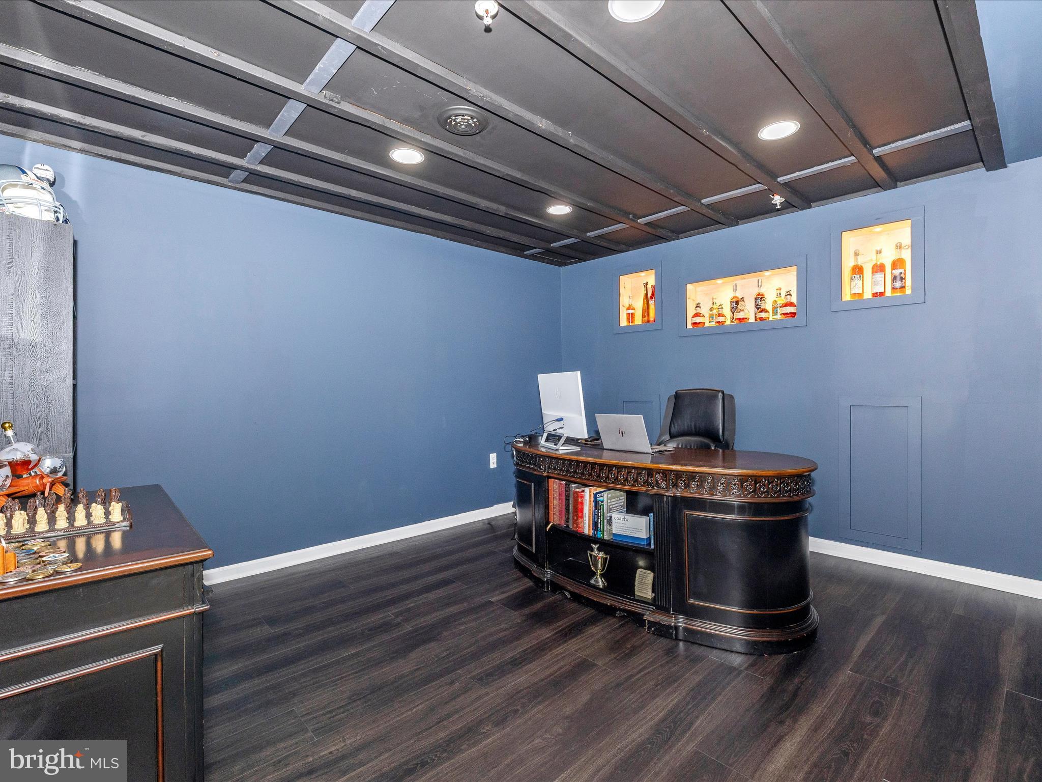 5816 Hawk Ridge Road Frederick, MD 21704 - Photo 42 of 97 a view of a workspace with furniture and wooden floor