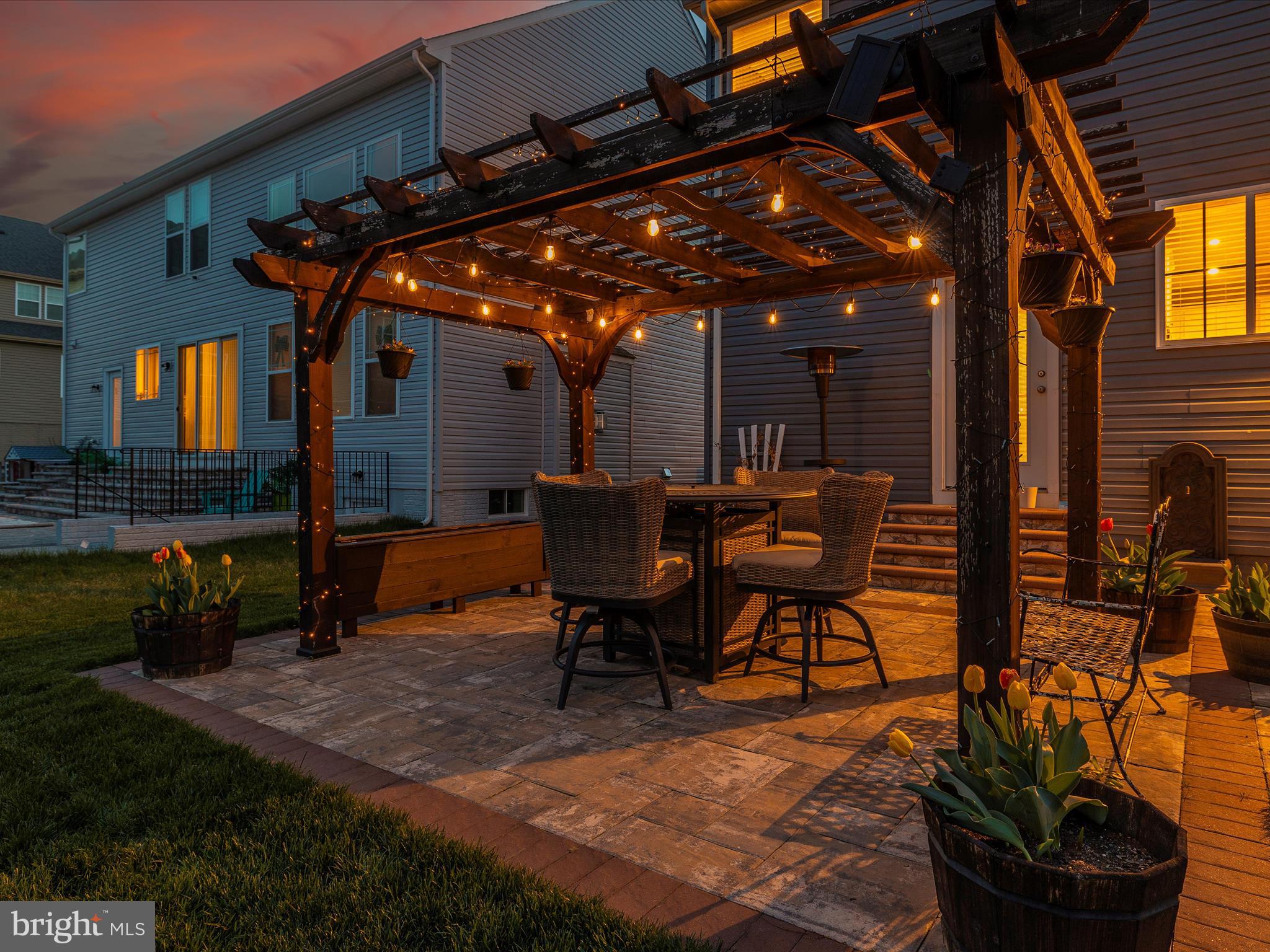 5816 Hawk Ridge Road Frederick, MD 21704 - Photo 79 of 97 a view of a patio with table and chairs with plants and wooden fence