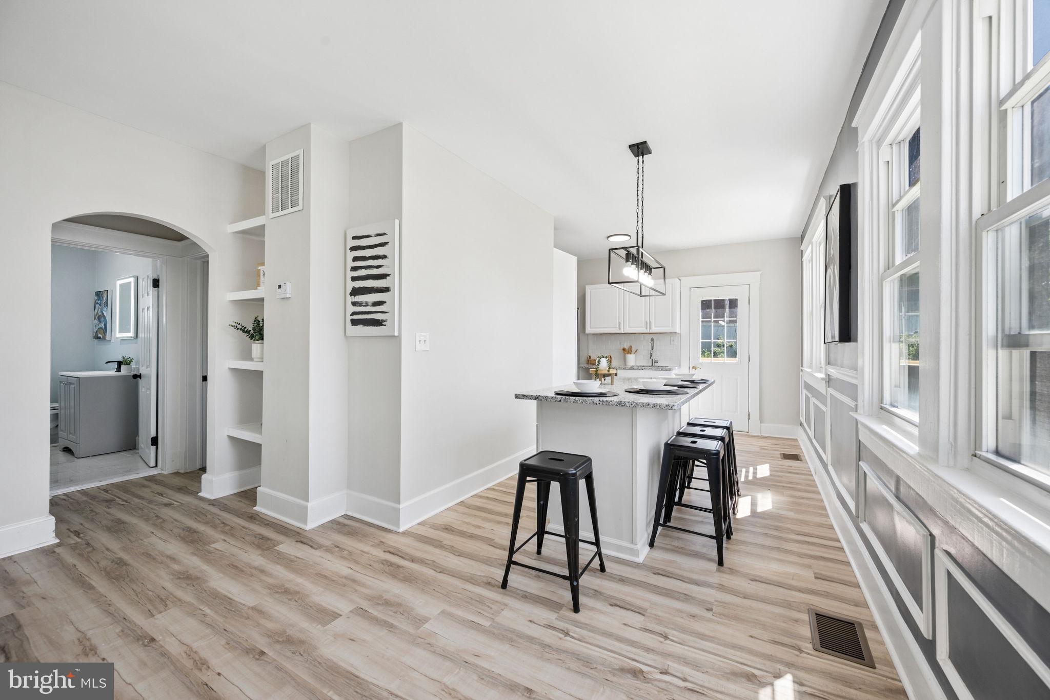 517 Valcour Road Baltimore, MD 21228 - Photo 20 of 47 a dining room with furniture and wooden floor