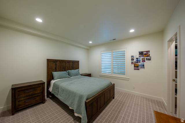 630 East Center Street Alpine, UT 84004 - Photo 73 of 115 Recessed ceiling lighting illuminates a room featuring light-toned walls and patterned carpeting