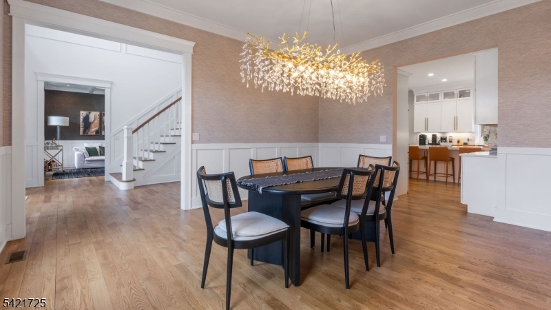 7 Woodcrest Road Florham Park, NJ 07932 - Photo 14 of 50 a view of a dining room with furniture wooden floor and chandelier