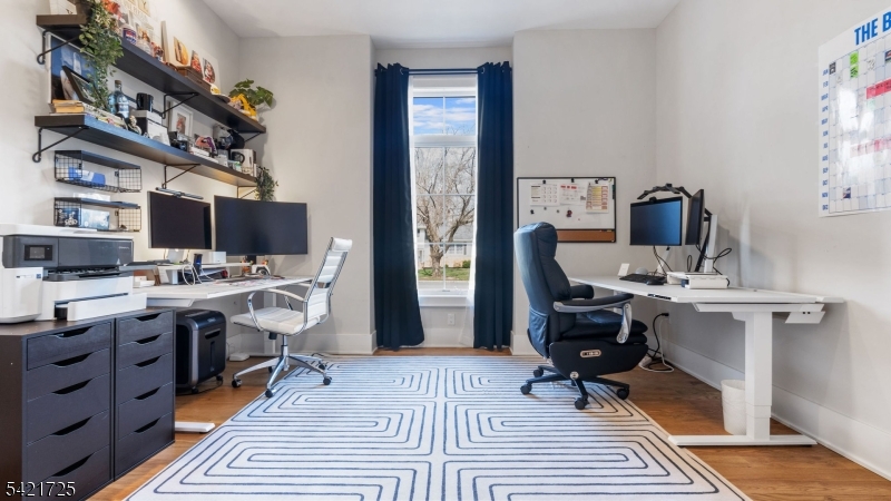 7 Woodcrest Road Florham Park, NJ 07932 - Photo 21 of 50 a view of a workspace with furniture and wooden floor