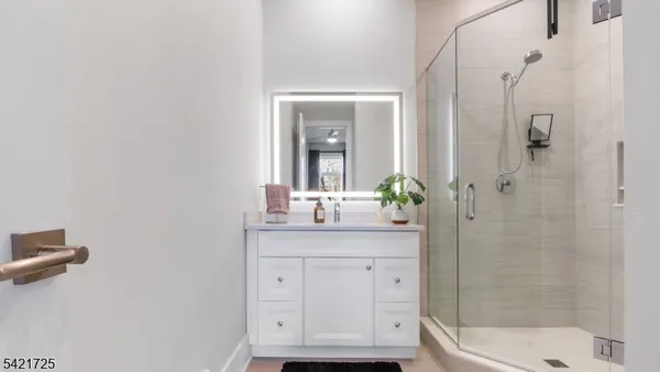 a white bath tub sitting next to a white sink