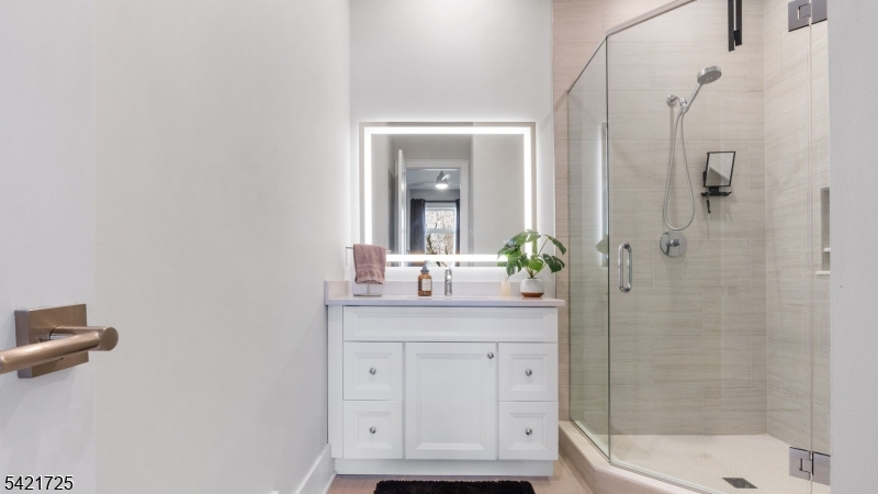 7 Woodcrest Road Florham Park, NJ 07932 - Photo 22 of 50 a bathroom with a granite countertop sink a toilet and shower