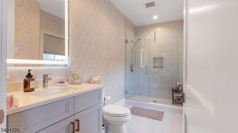 7 Woodcrest Road Florham Park, NJ 07932 - Photo 26 of 50 a bathroom with a sink a toilet and shower