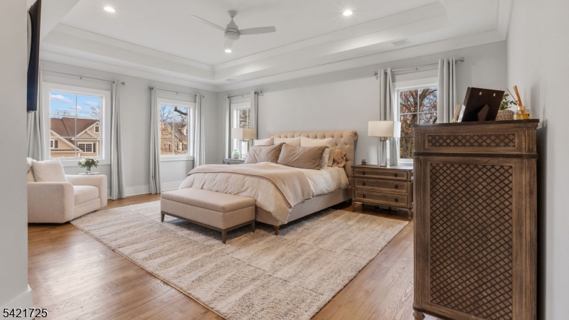 7 Woodcrest Road Florham Park, NJ 07932 - Photo 28 of 50 a spacious bedroom with a bed a table and large window