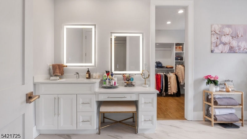 7 Woodcrest Road Florham Park, NJ 07932 - Photo 29 of 50 a bathroom with a sink vanity and a mirror