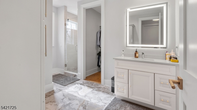 7 Woodcrest Road Florham Park, NJ 07932 - Photo 31 of 50 a bathroom with a sink and a mirror