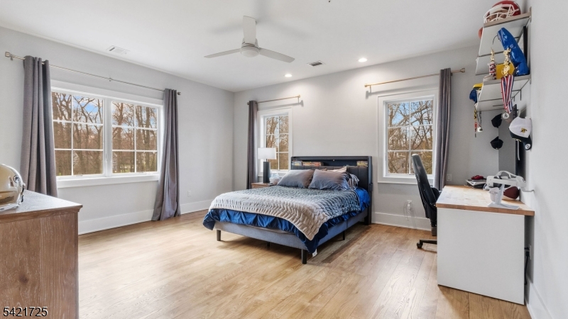 7 Woodcrest Road Florham Park, NJ 07932 - Photo 36 of 50 a spacious bedroom with a bed and a window