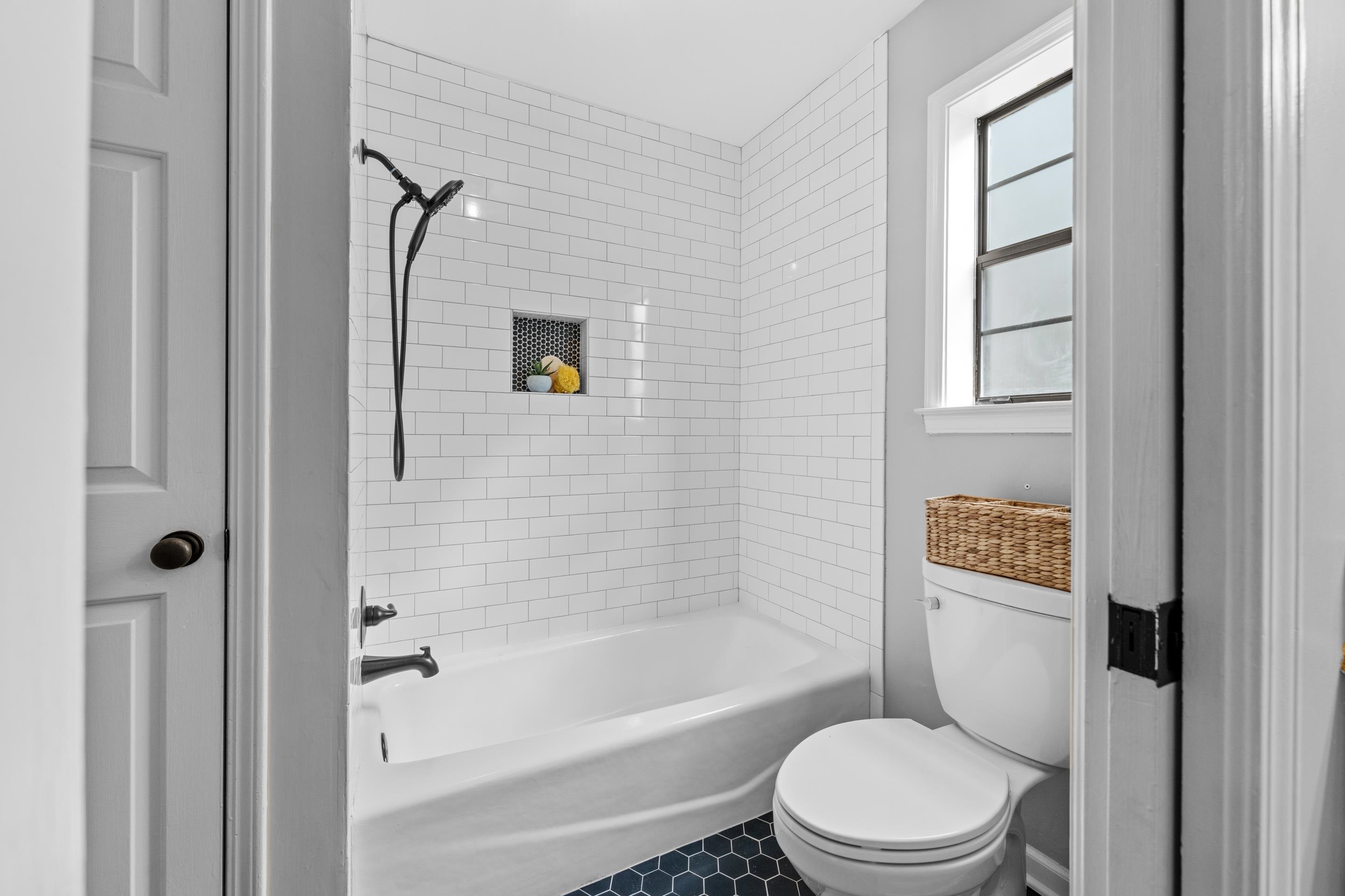179 Ericson Road Memphis, TN 38018 - Photo 16 of 39 a white toilet sitting next to a bath tub shower