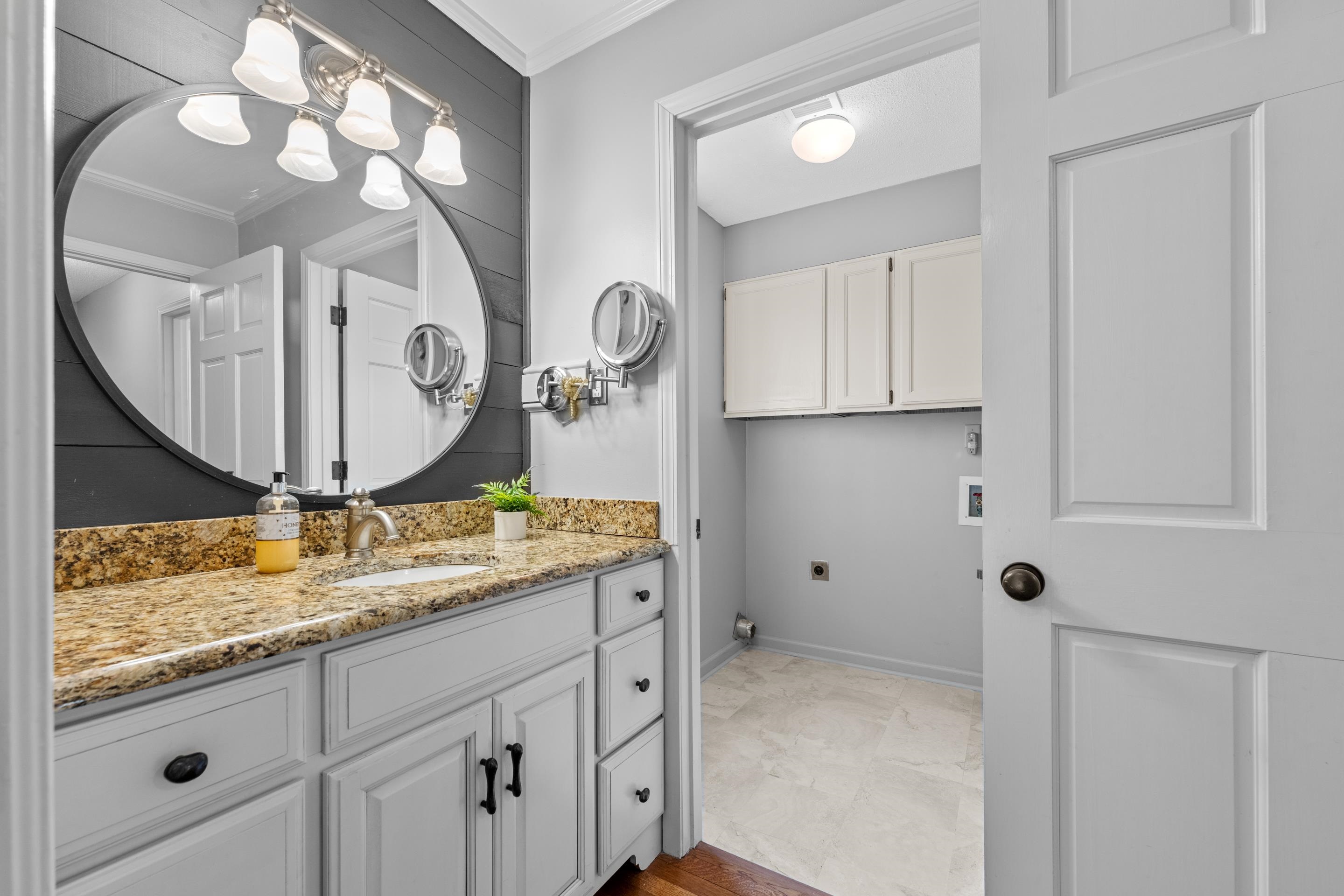179 Ericson Road Memphis, TN 38018 - Photo 17 of 39 a bathroom with a sink a vanity and a mirror