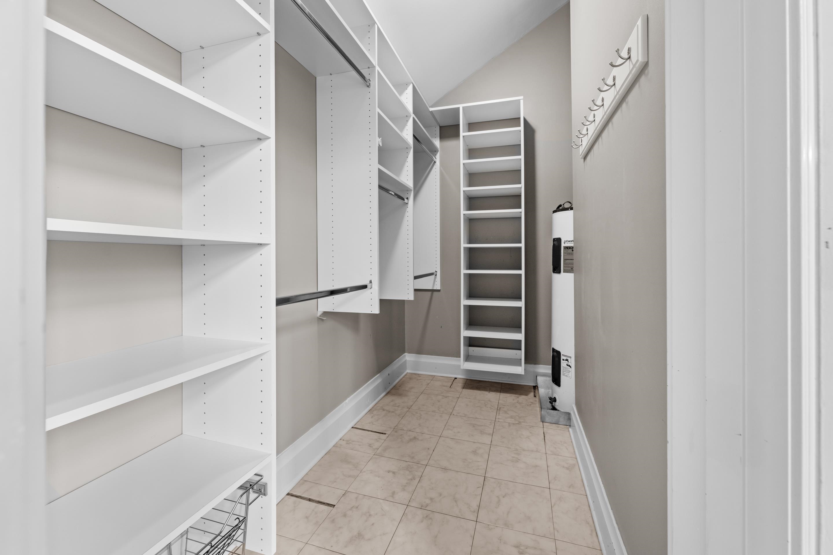 179 Ericson Road Memphis, TN 38018 - Photo 23 of 39 a view of walk in closet with empty racks