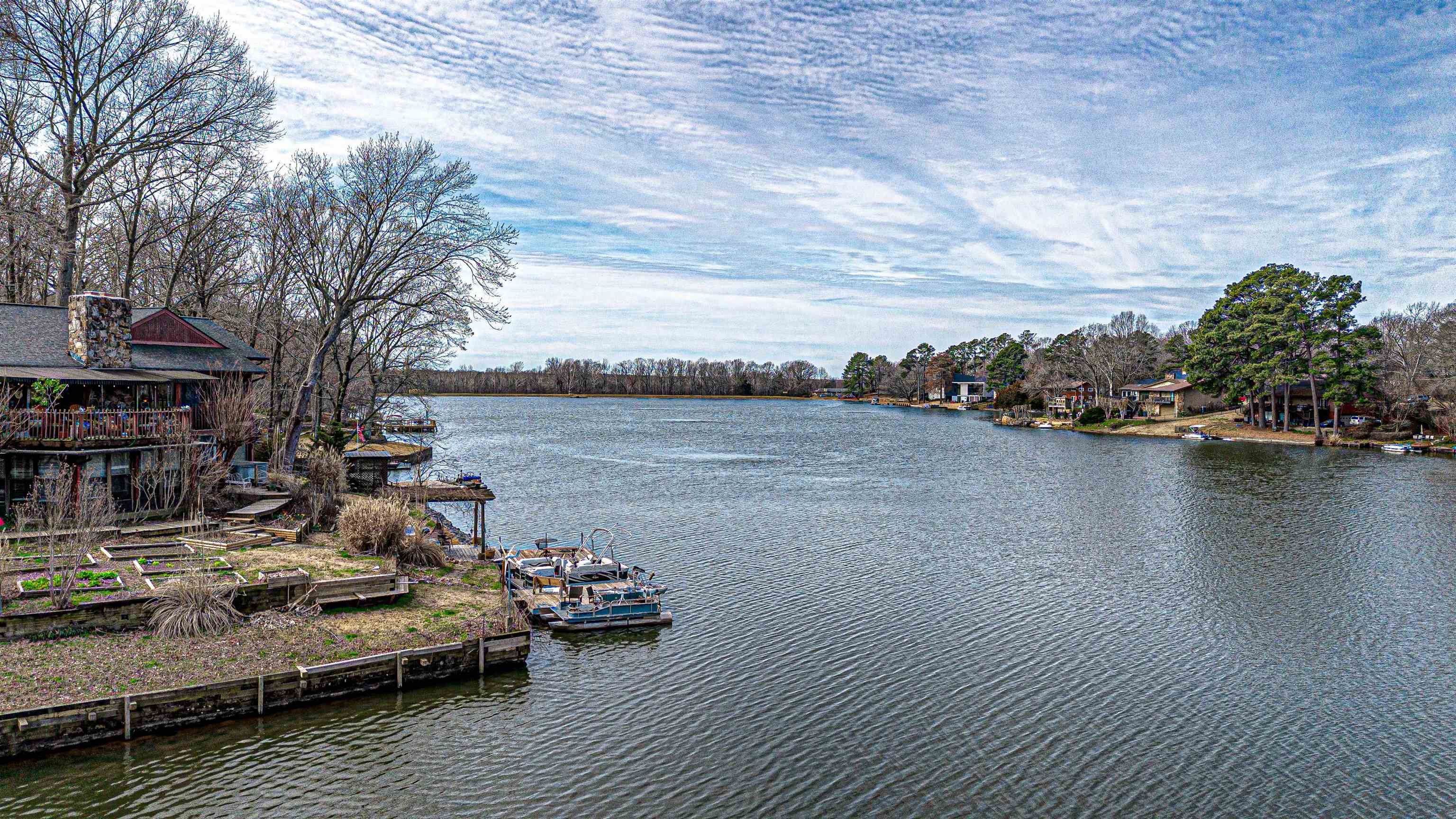 179 Ericson Road Memphis, TN 38018 - Photo 36 of 39 a view of a lake with couches and wooden fence