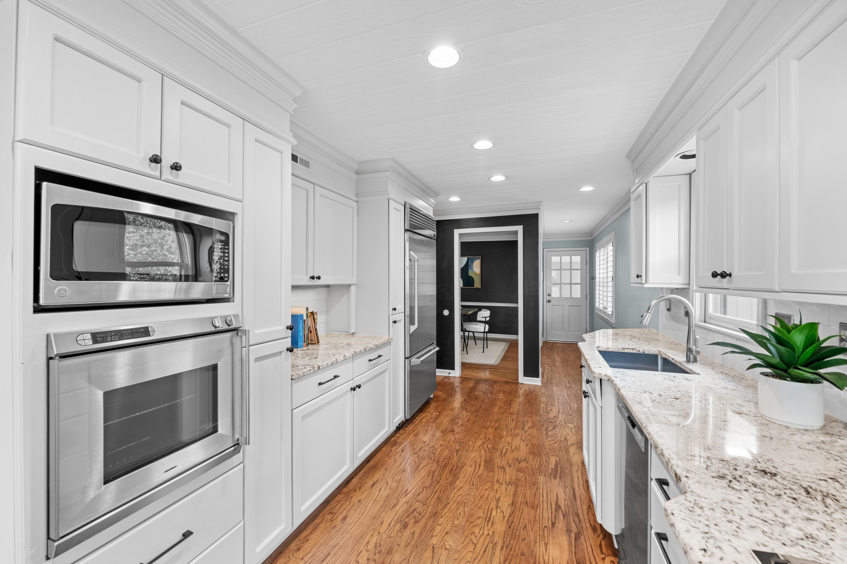 179 Ericson Road Memphis, TN 38018 - Photo 8 of 39 a kitchen with granite countertop a stove top oven microwave and cabinets