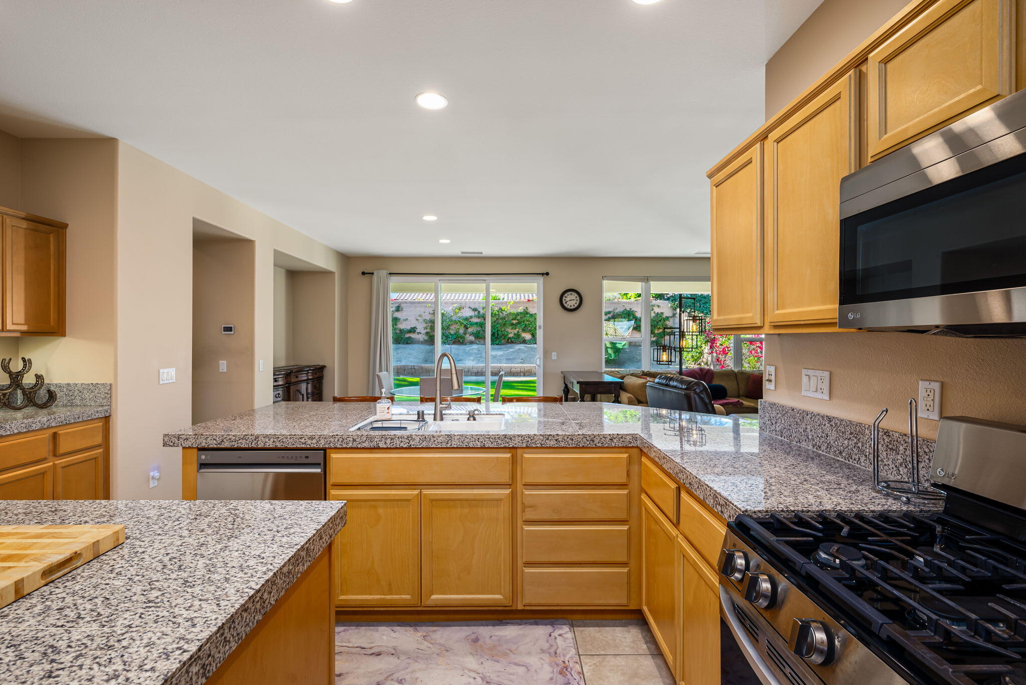 60237 Angora Court La Quinta, CA 92253 - Photo 16 of 75 a kitchen with a stove and a sink