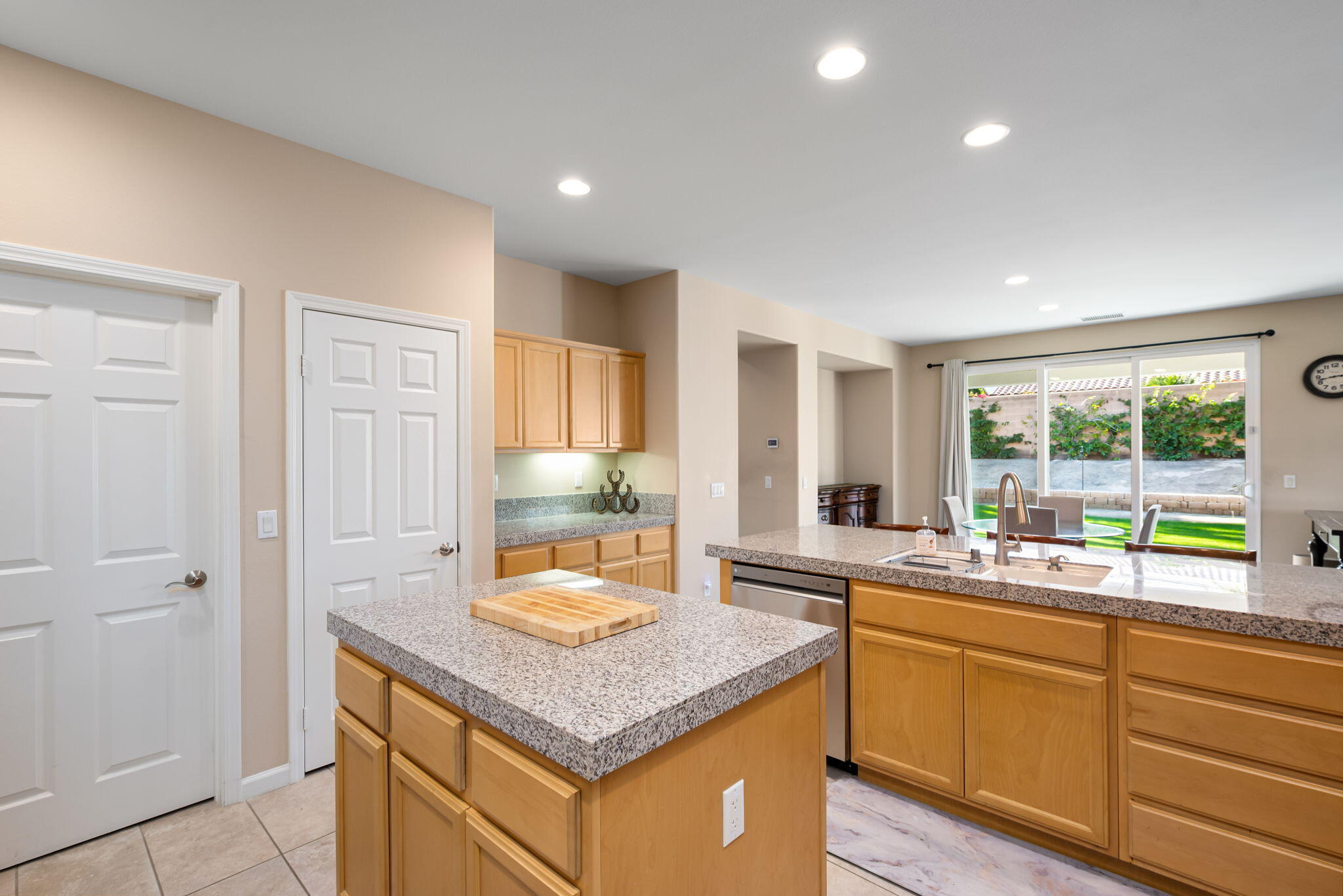 60237 Angora Court La Quinta, CA 92253 - Photo 17 of 75 a kitchen with a sink and cabinets