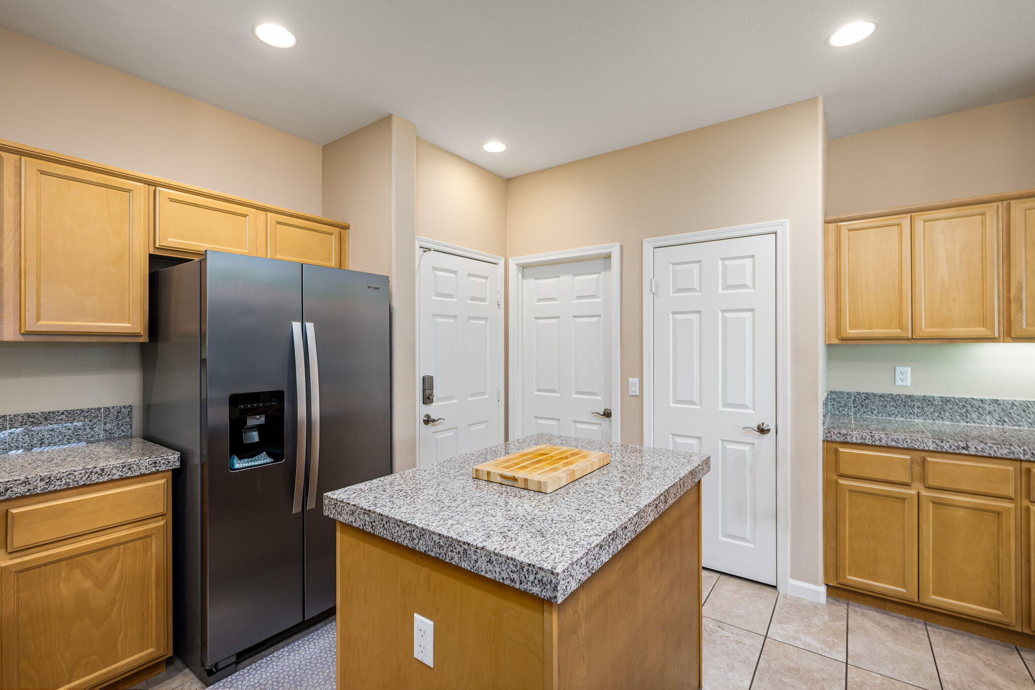 60237 Angora Court La Quinta, CA 92253 - Photo 18 of 75 a kitchen with stainless steel appliances granite countertop a refrigerator a stove and a sink