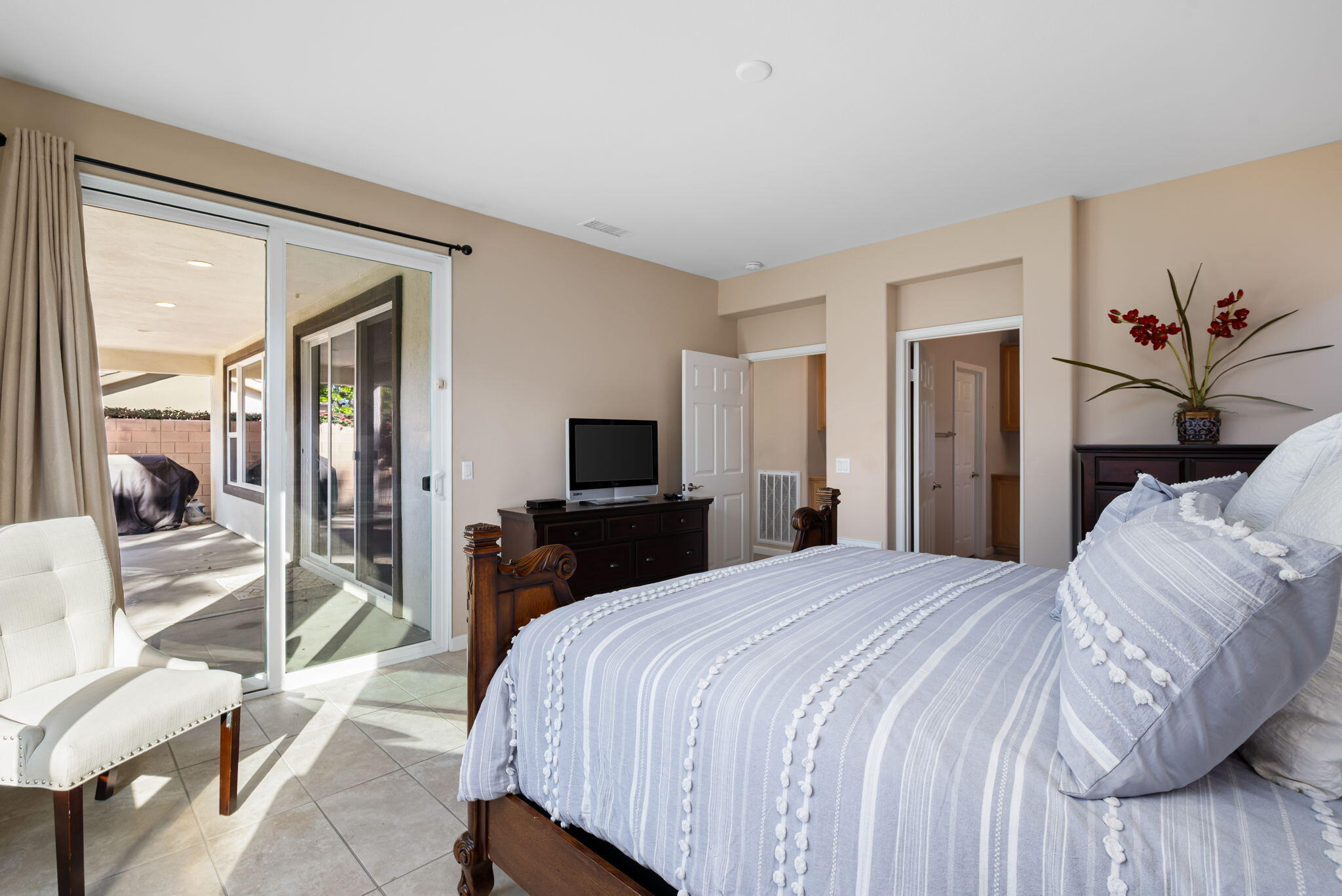 60237 Angora Court La Quinta, CA 92253 - Photo 20 of 75 a bedroom with a bed and a flat screen tv