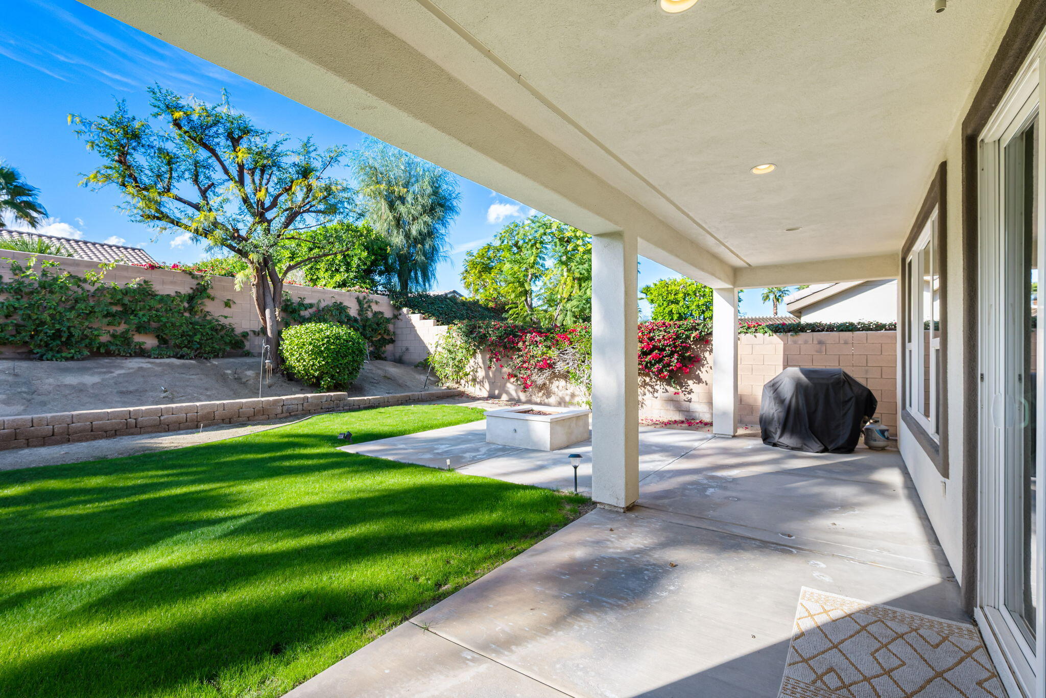 60237 Angora Court La Quinta, CA 92253 - Photo 27 of 75 a view of a porch and garden