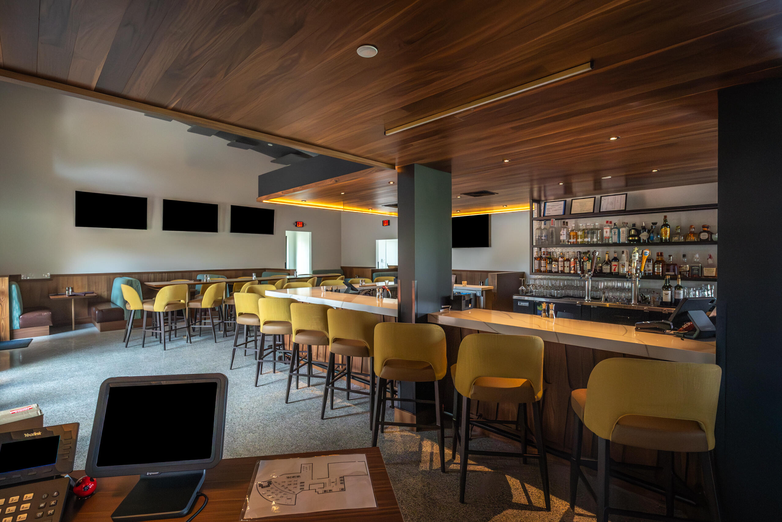60237 Angora Court La Quinta, CA 92253 - Photo 60 of 75 a dining hall with stainless steel appliances kitchen island granite countertop a table chairs and a bookshelf