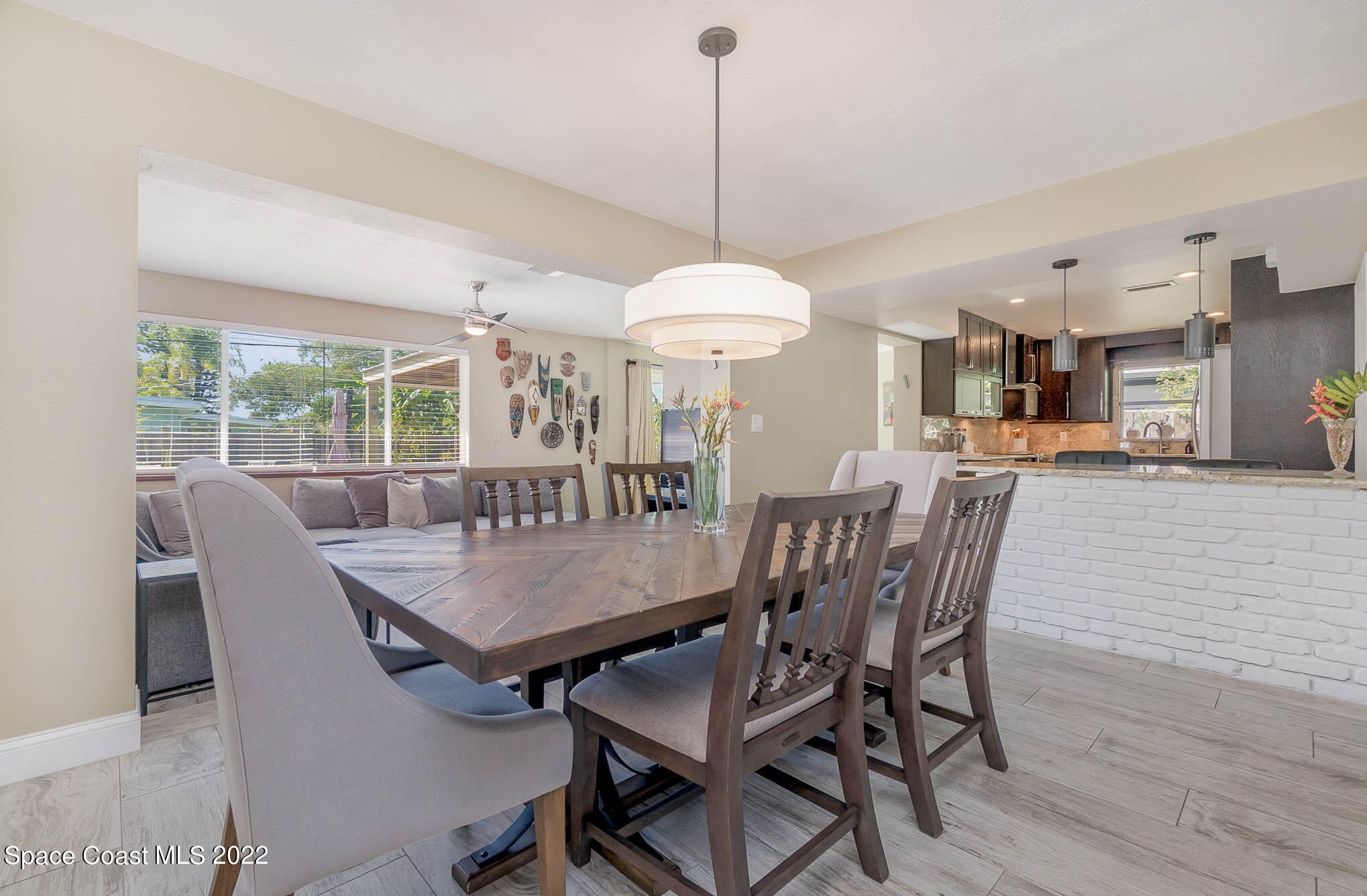 947 Santa Cruz Road Cocoa Beach, FL 32931 - Photo 12 of 29 a dining room with furniture window and wooden floor
