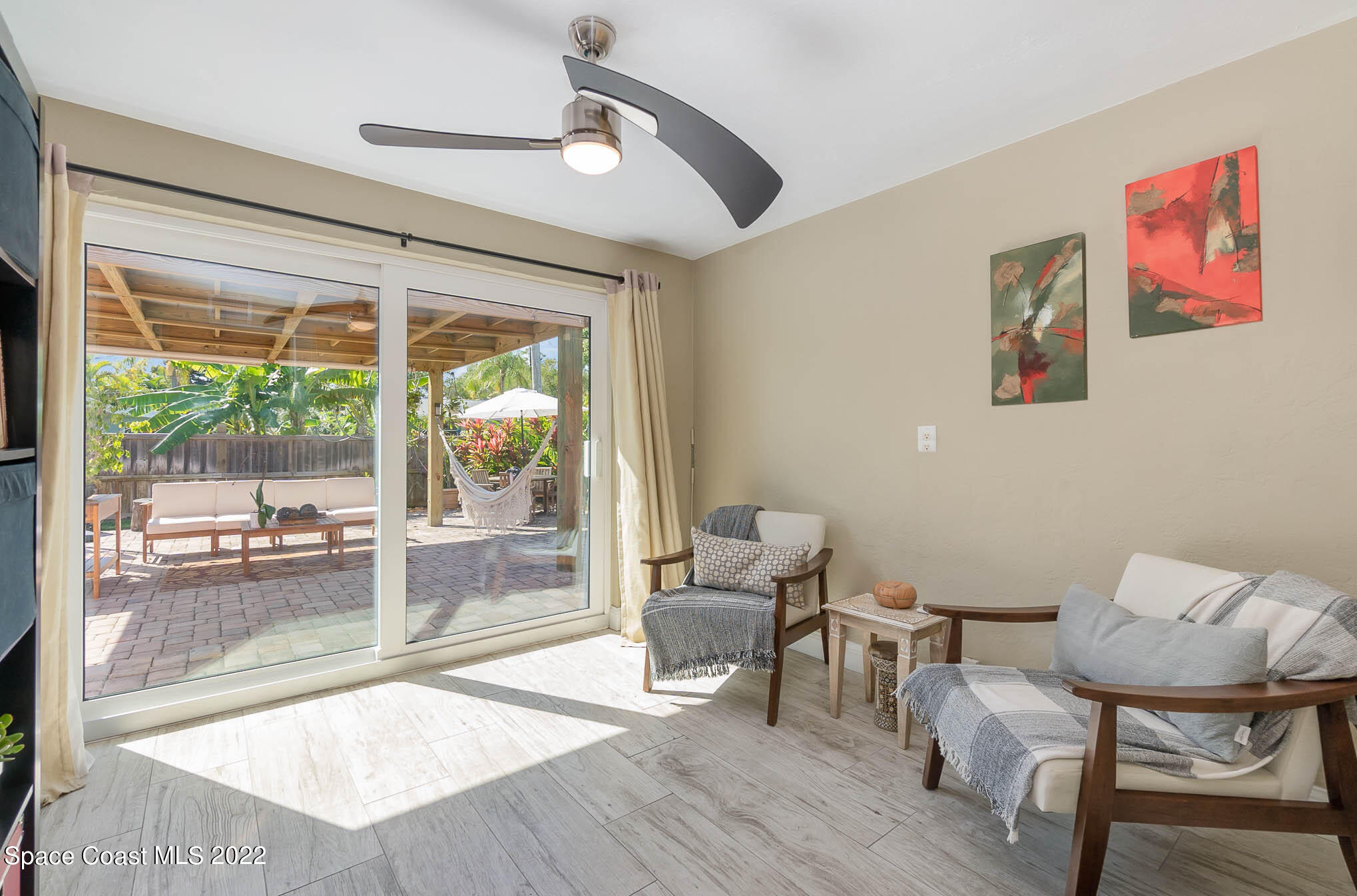 947 Santa Cruz Road Cocoa Beach, FL 32931 - Photo 17 of 29 a living room with furniture and a large window